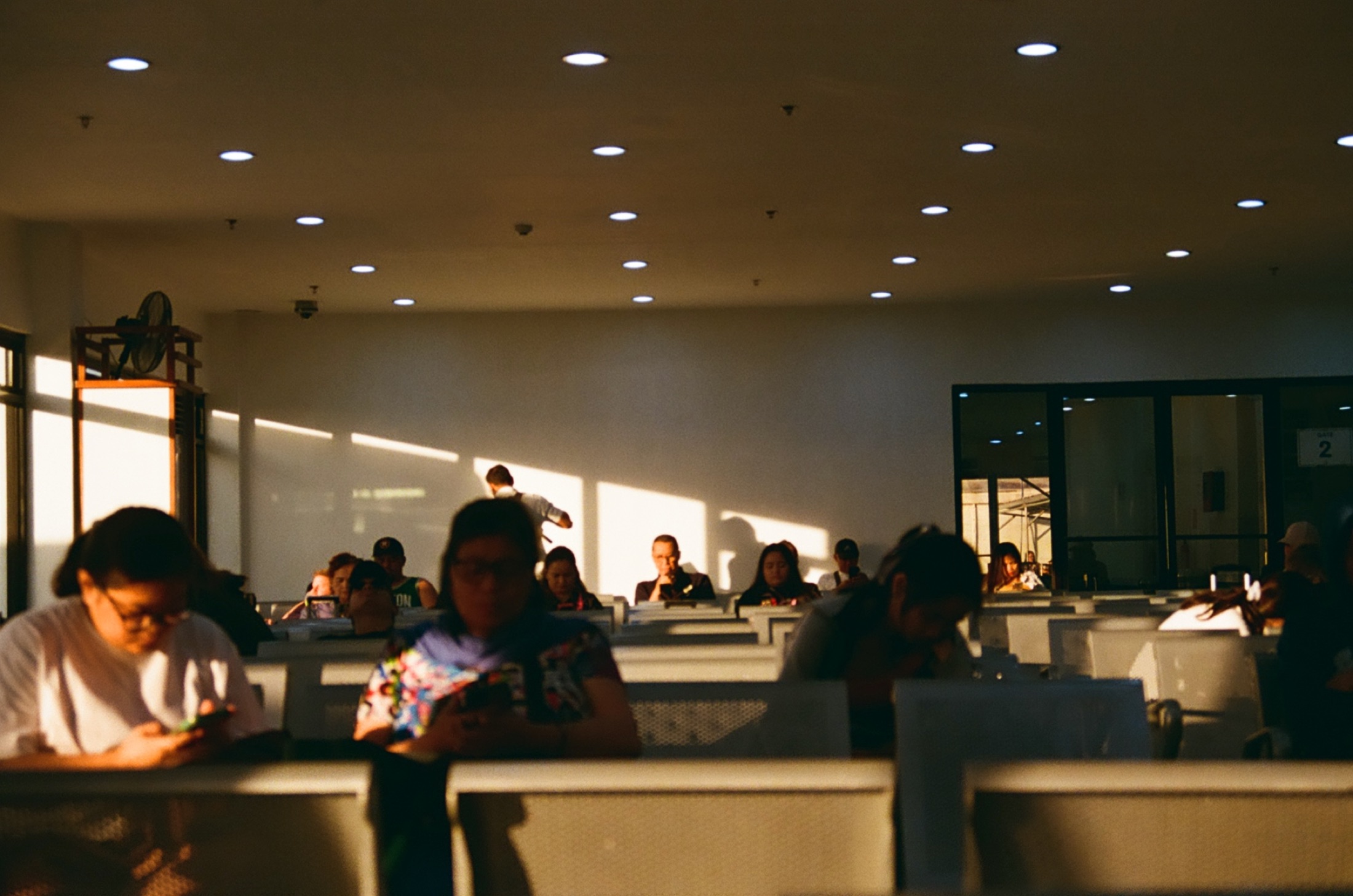 Diner interior in daylight, people eating in booths